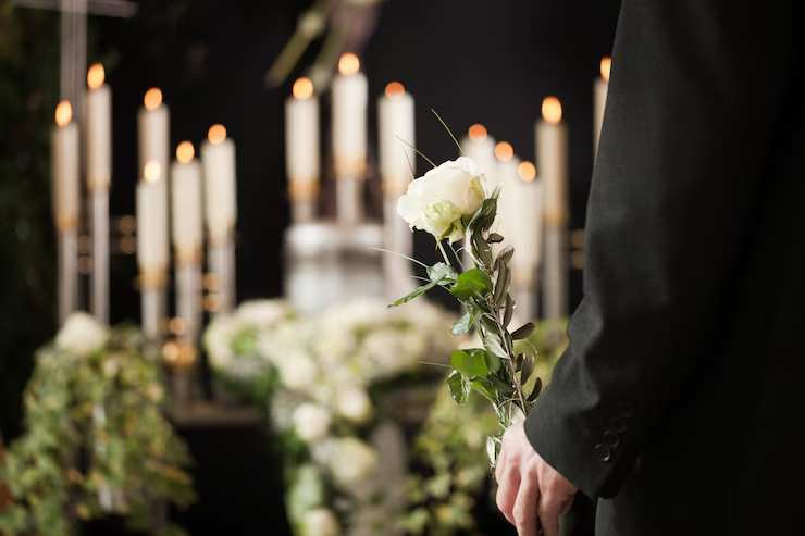 woman-holding-white-flower-funeral